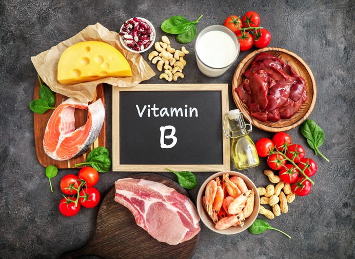 Vitamin B written on chalkboard with food around it